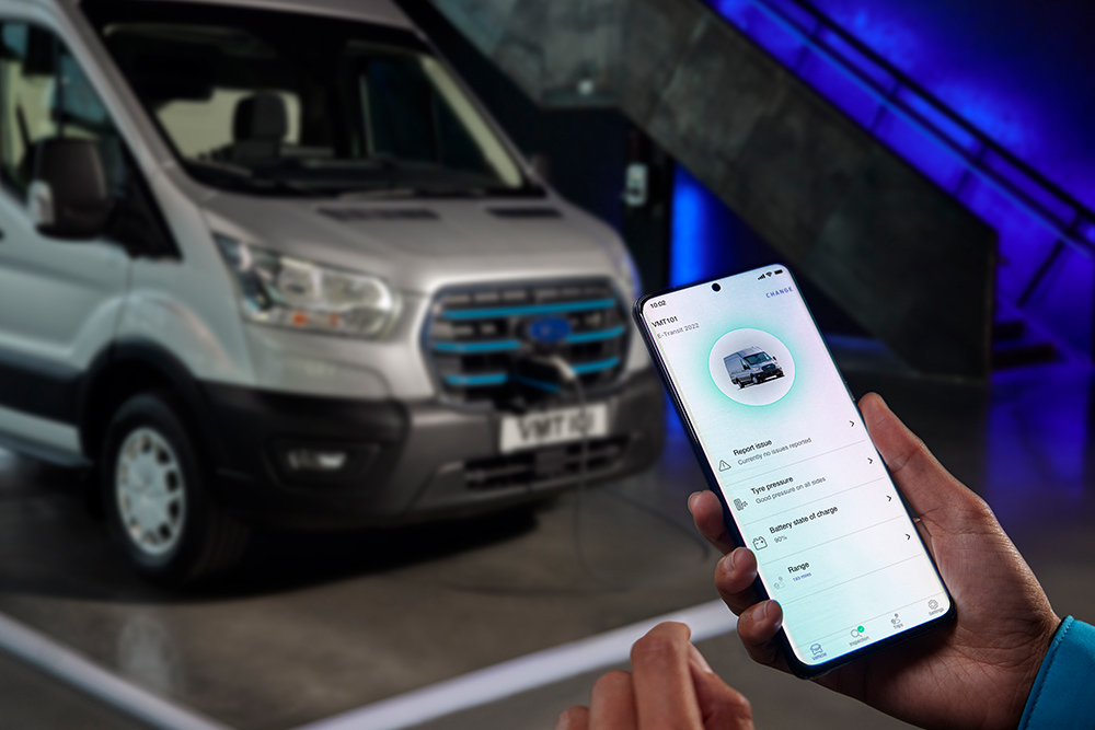 Person uses the Ford app to check charging status of a Ford E-Transit.